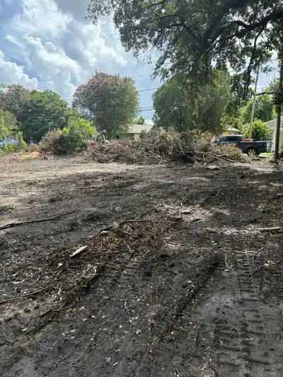 A cleared lot showing debris and dirt after lot clearing.
